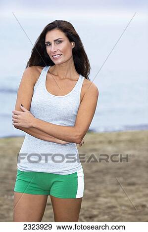Beauty Portrait Of A Woman On A Beach In Jogging Clothes View Large Photo Image Stock Photo - Beauty Portrait Of A Woman On A Beach In Jogging Clothes. Fotosearch