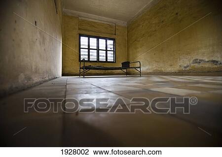 Bed Frame In Empty Prison Cell In Tuol Sleng, Phnom Penh, Cambodia View Large Photo Image Stock Image - Bed Frame In Empty Prison Cell In Tuol Sleng, Phnom Penh, Cambodia. Fotosearch