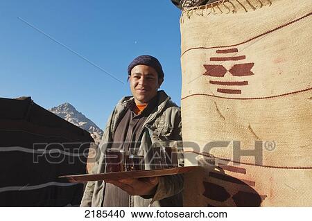 Bedouin Guide With Hot Coffee At The Captain's Eco Desert Camp, Wadi Rum, Jordan, Middle East View Large Photo Image Stock Image - Bedouin Guide With Hot Coffee At The Captain's Eco Desert Camp, Wadi Rum, Jordan, Middle East. Fotosearch