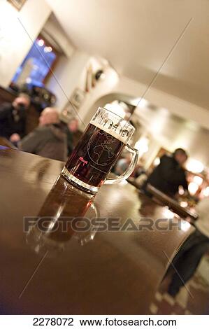 Beer on a table at the Beer Hall, Tromso's oldest pub; Tromso, Norway View Large Photo Image Stock Image - Beer on a table at the Beer Hall, Tromso's oldest pub; Tromso, Norway. Fotosearch
