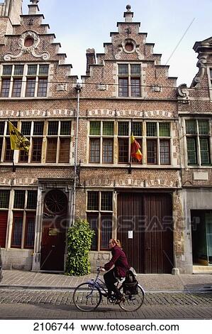 Picture - Belgium, Cyclist on Buurgstrat; Ghent. Fotosearch