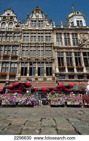 Stock Image - Belgium, People eating and drinking in outside cafes in Grand Place; Brussels. Fotosearch