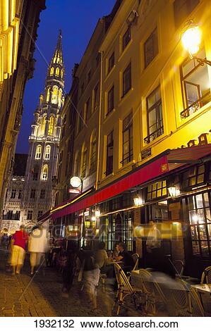Stock Image - Belgium, Restaurants at Grand Place at dusk; Brussels. Fotosearch