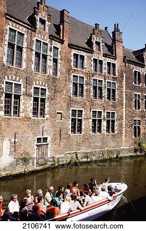 Stock Image - Belgium, Tourboat with tourist; Ghent. Fotosearch
