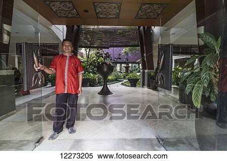 Bellboy at the Toraja Luta Resort, Rantepao, Toraja Land, South Sulawesi, Indonesia View Large Photo Image Stock Photography - Bellboy at the Toraja Luta Resort, Rantepao, Toraja Land, South Sulawesi, Indonesia. Fotosearch