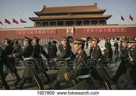 Beneath The Portrait Of Chairman Mao Zedong Marching Chinese Soldiers Keep Guard Outside The Forbidden City Tiananmen Square Beijing China Stock Photo Fotosearch