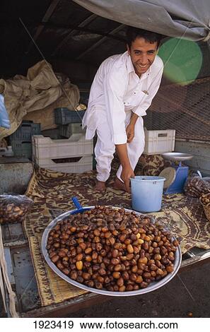Stock Photo - Berber Boy Selling Dates. Fotosearch