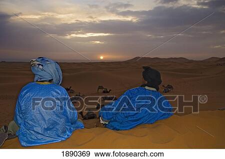 Stock Photo - Berber Men Watching Sunrise. Fotosearch