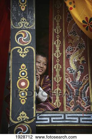 Stock Image - Bhutanese Boy Spectator In A Window. Fotosearch
