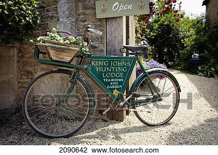 Stock Image - Bicycle At The King Johns Hunting Lodge And Tea Room In Lacock, Wiltshire, Uk. Fotosearch