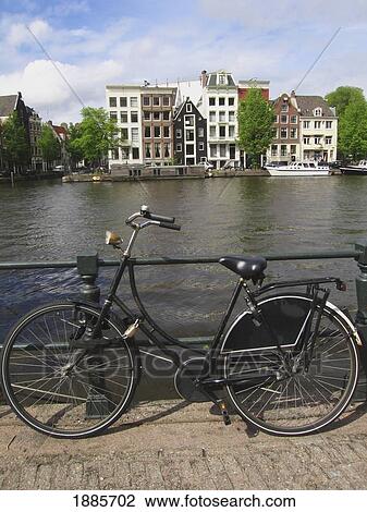 Bicycle Locked To Railing On Waterway View Large Photo Image Stock Image - Bicycle Locked To Railing On Waterway. Fotosearch