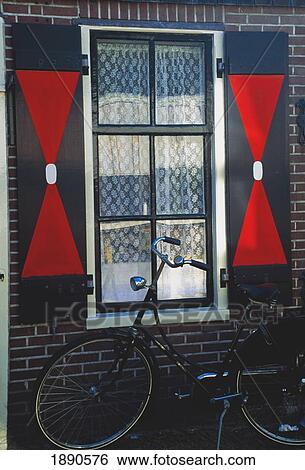Bicycle Outside House With Window Shutters View Large Photo Image Stock Photograph - Bicycle Outside House With Window Shutters. Fotosearch
