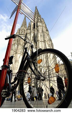 Bicycle Parked By Road Sign Near Cologne Cathedral, Low Angle View, Cologne, Germany View Large Photo Image Stock Image - Bicycle Parked By Road Sign Near Cologne Cathedral, Low Angle View, Cologne, Germany. Fotosearch