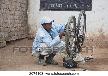 Bicycle Repairman In Antananarivo, Madagascar View Large Photo Image Stock Photo - Bicycle Repairman In Antananarivo, Madagascar. Fotosearch