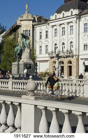 Bicycle Rider Ontriple Bridge, Ljubljana, Slovenia View Large Photo Image Stock Photo - Bicycle Rider Ontriple Bridge, Ljubljana, Slovenia. Fotosearch
