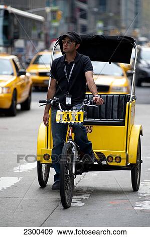 Stock Photo - Bicycle Taxis In Midtown Manhattan, New York, Usa. Fotosearch