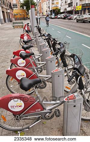 Stock Photo - Bicycles For Hire; Seville, Andalucia, Spain. Fotosearch