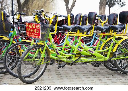 Stock Image - Bicycles for rent at Houhai Park; Shichahai, Beijing, China. Fotosearch