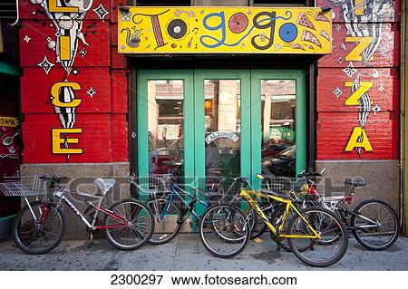 Stock Photo - Bicycles Outside A Pizzeria In The West Village, Manhattan, New York, Usa. Fotosearch