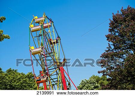 Big Wheel Over Blue Sky At Lovebox Festival In Victoria Park, London, Uk View Large Photo Image Stock Image - Big Wheel Over Blue Sky At Lovebox Festival In Victoria Park, London, Uk. Fotosearch
