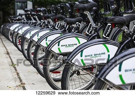Bike Share bicycles in a row; Toronto, Ontario, Canada View Large Photo Image Stock Photo - Bike Share bicycles in a row; Toronto, Ontario, Canada. Fotosearch
