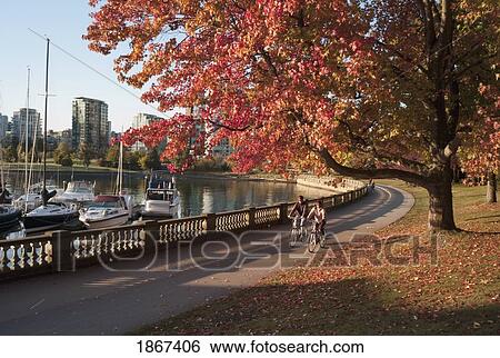 Stock Photograph - Bikers In Stanley Park; Vancouver, British Columbia, Canada. Fotosearch