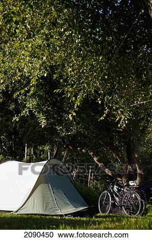 Stock Image - Bikes And Tent In A Campsite, Mutriku, Basque Country, Spain. Fotosearch