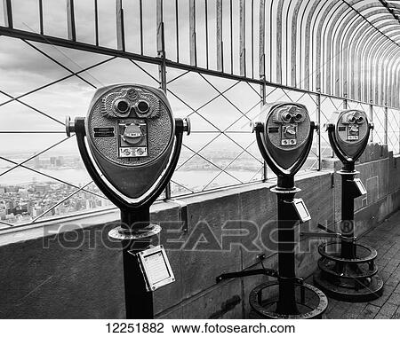 Stock Image - Binocular tower viewers and view from the top of the Empire State Building; New York City, New York, United States of America. Fotosearch