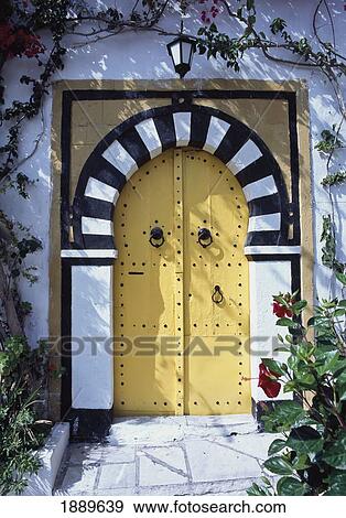 Black And White Arched Doorway With Yellow Doors. View Large Photo Image Stock Photo - Black And White Arched Doorway With Yellow Doors.. Fotosearch