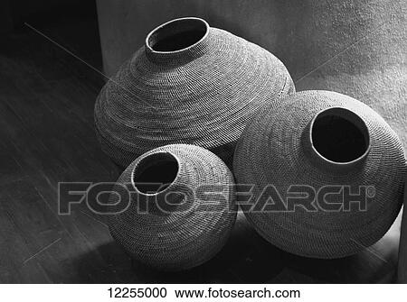 Stock Image - Black and white shot of finely woven traditional African baskets, Kruger National Park; Mpumalanga Province, South Africa. Fotosearch
