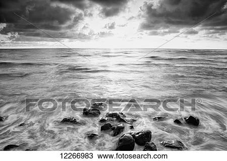 Black and white sunrise over the pacific ocean; Wailua, Kauai, Hawaii, United States of America View Large Photo Image Stock Image - Black and white sunrise over the pacific ocean; Wailua, Kauai, Hawaii, United States of America. Fotosearch