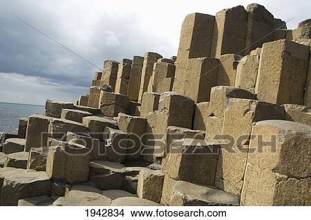 Picture - Black Basalt Columns Sticking Out Of The Sea, Giant's Causeway, Northern Ireland, United Kingdom. Fotosearch