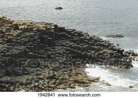 Black Basalt Columns Sticking Out Of The Sea, Giant's Causeway, Northern Ireland, United Kingdom View Large Photo Image Stock Image - Black Basalt Columns Sticking Out Of The Sea, Giant's Causeway, Northern Ireland, United Kingdom. Fotosearch