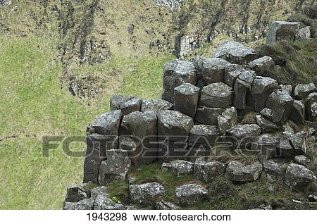 Stock Photo - Black Basalt Columns Sticking Out Of The Sea, Giant's Causeway, Northern Ireland, United Kingdom. Fotosearch