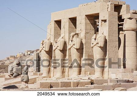 Picture - Black Granite Head Of Ramses Ii And Osirid Pillars Of The Temple Of Ramses Ii At The Ramesseum, Western Thebes, Qina, Egypt. Fotosearch