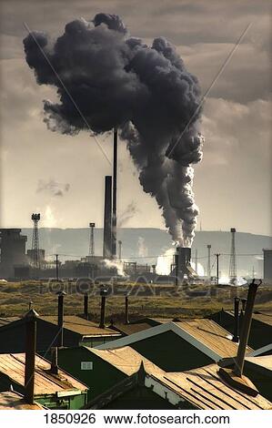 Stock Photograph - Black Smoke Emitting From Factory Smokestack; Teesside, North East England. Fotosearch