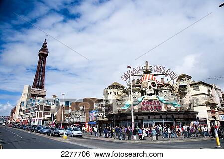 Stock Photograph - Blackpool Tower and Coral Island amusement arcade, Blackpool Pleasure beach; Blackpool, Lancashire, England. Fotosearch