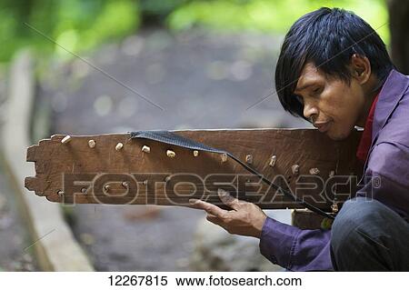 Blind musician; Mondulkiri, Cambodia View Large Photo Image Stock Photography - Blind musician; Mondulkiri, Cambodia. Fotosearch