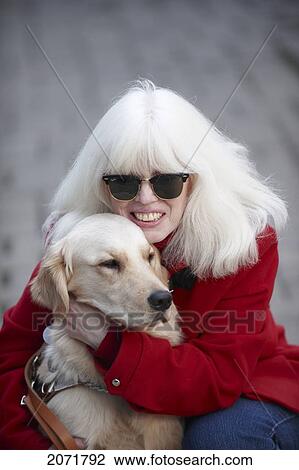 Stock Image - Blind Woman With Guide Dog, Courtice, Ontario. Fotosearch