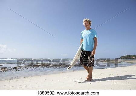 Blond Surfer Walking On Beach With Surfboard View Large Photo Image Stock Image - Blond Surfer Walking On Beach With Surfboard. Fotosearch