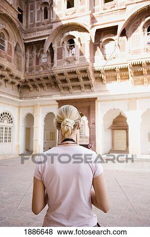 Blond Tourist Looking At Building In Fort Mehrangarh View Large Photo Image Stock Photo - Blond Tourist Looking At Building In Fort Mehrangarh. Fotosearch