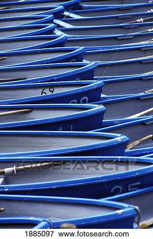 Stock Photo - Blue And White Boats Moored, Close Up. Fotosearch