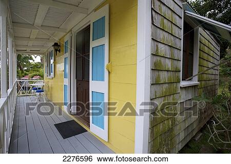 Stock Photograph - Blue and yellow house; Nevis Island, West Indies. Fotosearch