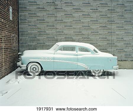 Stock Image - Blue Buick Car In Snow. Fotosearch