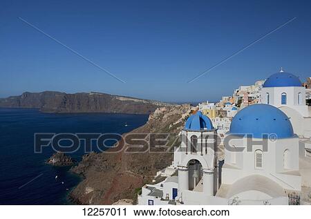Blue domed churches on a cliff overlooking the caldera; Oia, Santorini, Cyclades, Greek Islands, Greece View Large Photo Image Stock Image - Blue domed churches on a cliff overlooking the caldera; Oia, Santorini, Cyclades, Greek Islands, Greece. Fotosearch