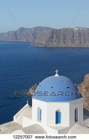 Blue domed churches on a cliff overlooking the caldera; Oia, Santorini, Cyclades, Greek Islands, Greece View Large Photo Image Stock Photo - Blue domed churches on a cliff overlooking the caldera; Oia, Santorini, Cyclades, Greek Islands, Greece. Fotosearch