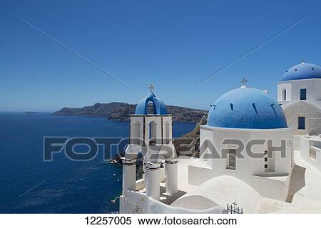Stock Photography - Blue domed churches on a cliff overlooking the caldera; Oia, Santorini, Cyclades, Greek Islands, Greece. Fotosearch