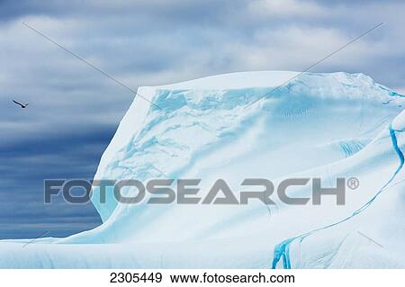 Stock Photo - Blue ice of iceberg off west coast; Greenland. Fotosearch