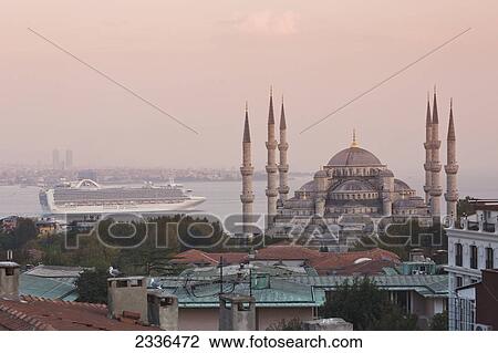 Stock Image - Blue Mosque With A Cruise Ship In The Bosphorus In The Background; Istanbul, Turkey. Fotosearch