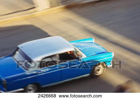 Stock Photo - Blue taxi on the road; Harar, Ethiopia. Fotosearch